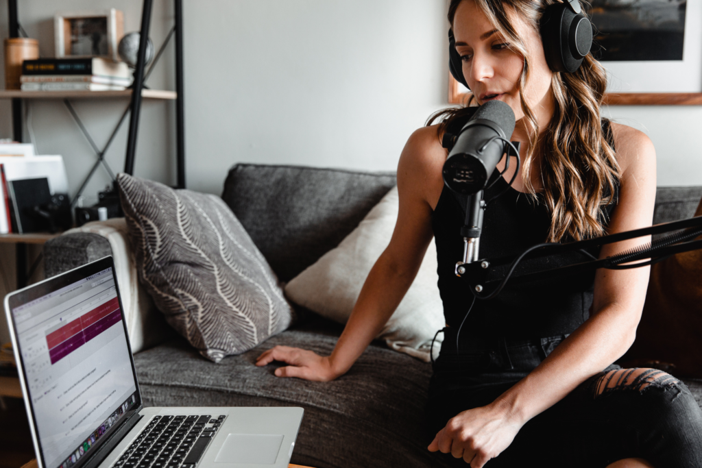 A woman producing a podcast